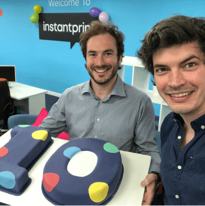 instantprint founders Adam and James with their 10th birthday cake
